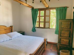 Postel nebo postele na pokoji v ubytování Hostal del Carmen