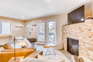 a living room with a couch and a fireplace at Heavenly Hideaway in Stateline