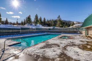 a swimming pool covered in snow and ice at Heavenly Hideaway in Stateline