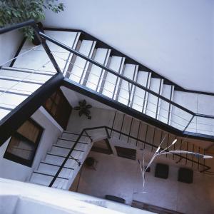 an image of a building with a spiral staircase at Hostel Carlos Gardel in Buenos Aires