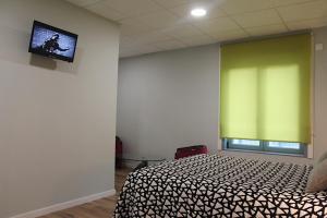 Telewizja i/lub zestaw kina domowego w obiekcie Casa Costoya
