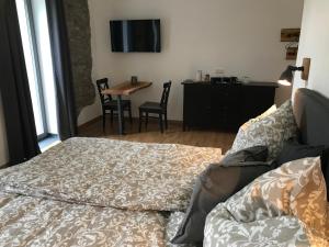 TV a/nebo společenská místnost v ubytování Gästehaus Lausnitz Zimmer