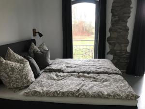 Postel nebo postele na pokoji v ubytování Gästehaus Lausnitz Zimmer