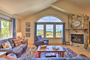 a living room with a couch and a fireplace at Pagosa Springs Home with Deck and Grill, Walk to Town! in Pagosa Springs
