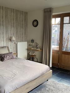 Postel nebo postele na pokoji v ubytování B&B 't Hoveke