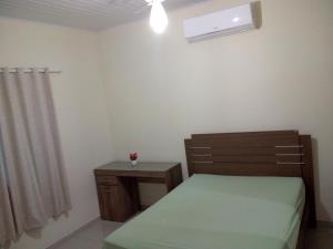 Postel nebo postele na pokoji v ubytování Casa para temporada c/ ar condicionado