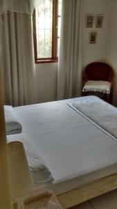 Postel nebo postele na pokoji v ubytování Penedo Flats + 10 fotografií