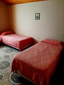 Una cama o camas en una habitación de Los Dos Pinos