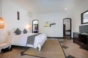 Singgah Villas Seminyak客房内的一张或多张床位