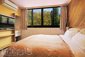 Postel nebo postele na pokoji v ubytování Sun Moon Lake Tan Hsiang Yu B&B