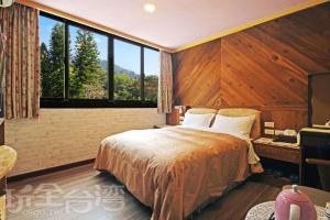 Postel nebo postele na pokoji v ubytování Sun Moon Lake Tan Hsiang Yu B&B