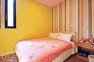 Postel nebo postele na pokoji v ubytování Sun Moon Lake Tan Hsiang Yu B&B