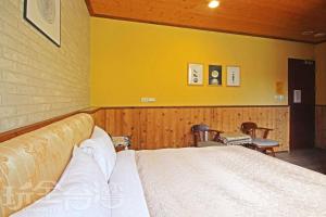 Postel nebo postele na pokoji v ubytování Sun Moon Lake Tan Hsiang Yu B&B