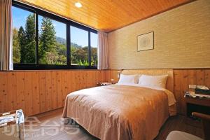 Postel nebo postele na pokoji v ubytování Sun Moon Lake Tan Hsiang Yu B&B