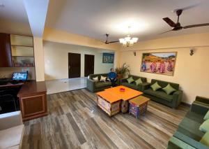 a living room with a couch and a table at Martam Village Homestay in Gangtok