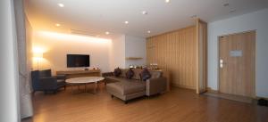 TV a/nebo společenská místnost v ubytování Ulsan City Hotel