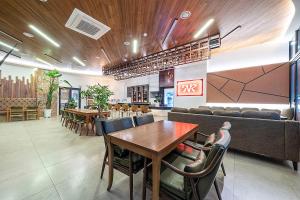 a dining room with a table and chairs at City Hotel Wonju in Wonju