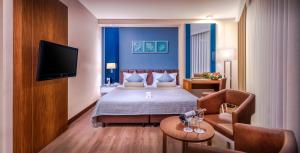 TV a/nebo společenská místnost v ubytování Baia Lara Hotel