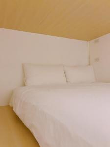 Cama o camas de una habitación en PlainStay Hostel