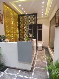 a lobby of a hotel with a reception desk at Hotel Corbett Kingdom in Rāmnagar