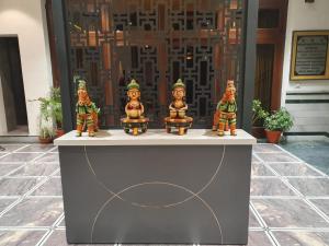 a group of figurines sitting on top of a counter at Hotel Corbett Kingdom in Rāmnagar