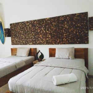 Postel nebo postele na pokoji v ubytování Harris surf villa