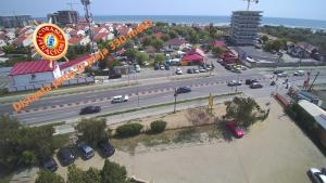 an aerial view of a city with cars parked on a highway at Club de Vacanta Corabia Piratilor - Family Resort Mamaia Nord in Mamaia Nord
