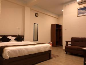 Postel nebo postele na pokoji v ubytování Hotel Satyam