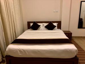 Postel nebo postele na pokoji v ubytování Hotel Satyam