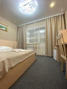 Cama o camas de una habitación en Hotel Sozvezdie Medveditsy