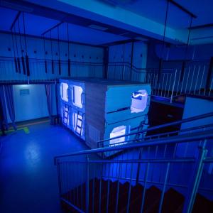 an empty room with blue lights in a building at area24|7 Europaplatz in Karlsruhe