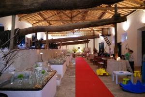 a large room with tables and a red carpet at Villa das Hortas - modern villa at Silvercoast - Portugal in Salir do Porto