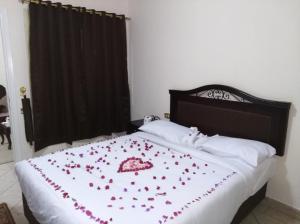Postel nebo postele na pokoji v ubytování Al Saraya October Hotel