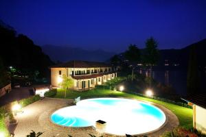 The swimming pool at or close to TREMEZZO RESIDENCE 5-1 of 11 apartments in an exclusive residence by Italian Apartments