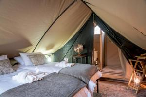Postel nebo postele na pokoji v ubytování Bundox Explorer Camp