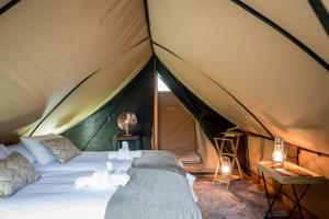 Postel nebo postele na pokoji v ubytování Bundox Explorer Camp
