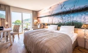 Postel nebo postele na pokoji v ubytování PAPA RHEIN - Hotel & Spa + 37 fotografií