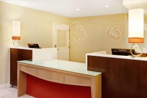 a lobby with a reception desk in a hotel room at MainStay Suites Chicago Schaumburg in Schaumburg