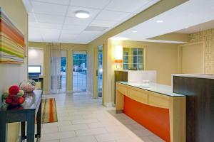 a room with a kitchen with a counter top at Suburban Studios Charlotte - Executive Park in Charlotte