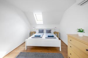 Postel nebo postele na pokoji v ubytování Apartmán Ema Dolní Dunajovice