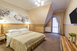 Postel nebo postele na pokoji v ubytování Petros Hotel