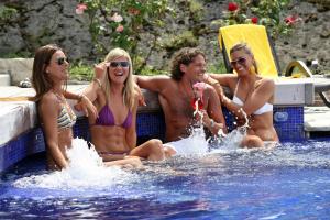 a group of people sitting in a swimming pool at Hotel Sailing Center in Malcesine