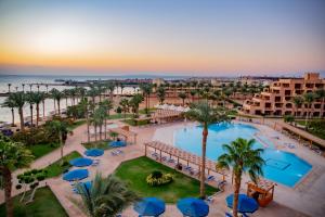 an aerial view of a resort with a pool and palm trees at Continental Hotel Hurghada in Hurghada