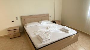 Giường trong phòng chung tại OniRana Apartments