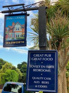 a sign for a great pub great food and a sign for a house at Inn in the Park in Bournemouth