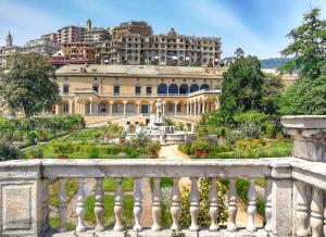a view of a large building with a garden at Amba Alagi Apartment in Genoa
