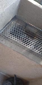 a metal grate on the bottom of a stairs at CASA SOL de PIRANGI in Pirangi do Sul