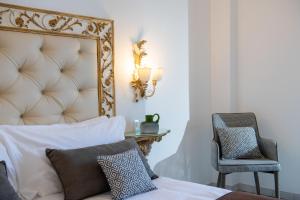 Postel nebo postele na pokoji v ubytování Hotel Reginella