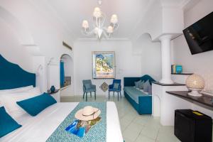 TV a/nebo společenská místnost v ubytování Hotel Reginella