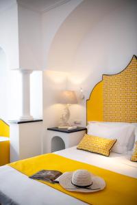 Postel nebo postele na pokoji v ubytování Hotel Reginella